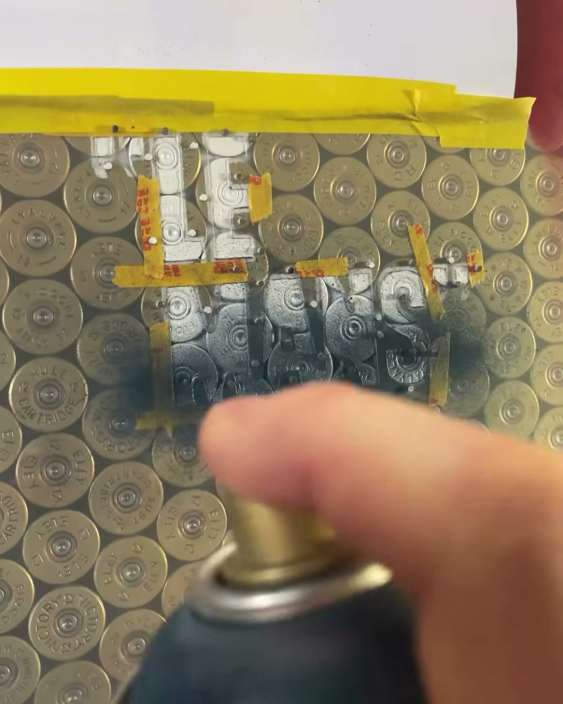 Spraying a tone through the stencil